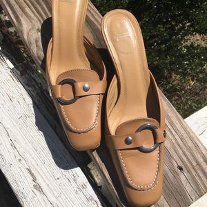 Coach Sheri calf slide with kitten heel.